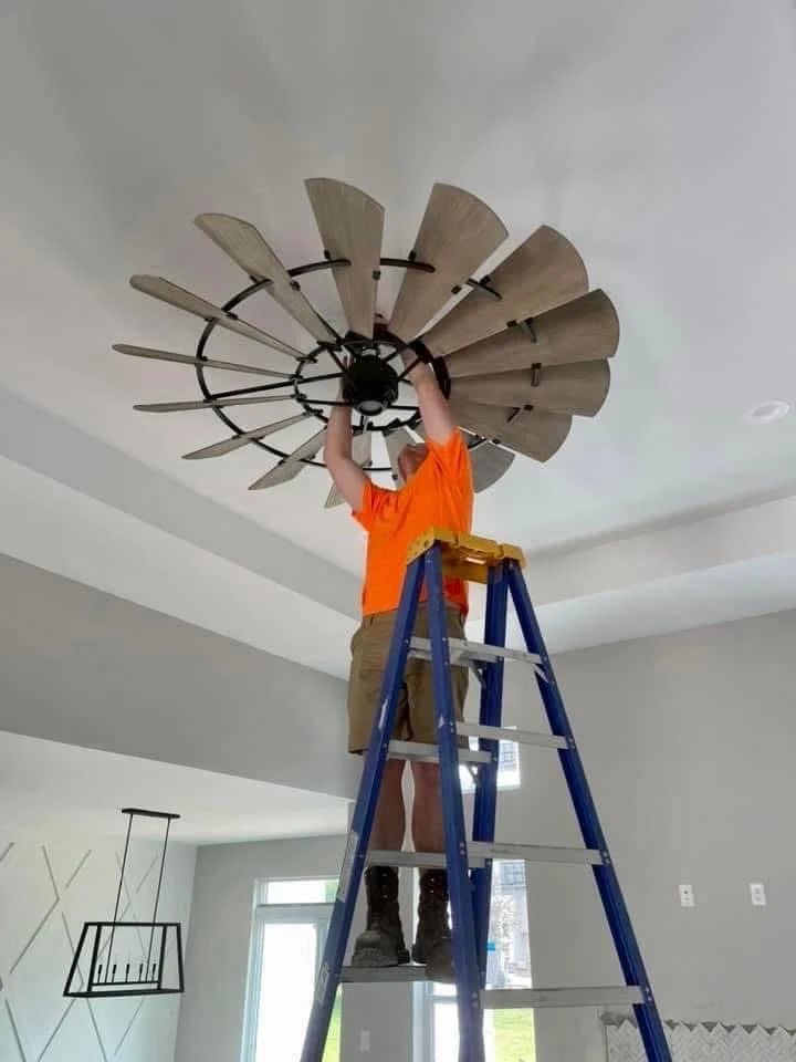 Large windmill ceiling fan installation in progress